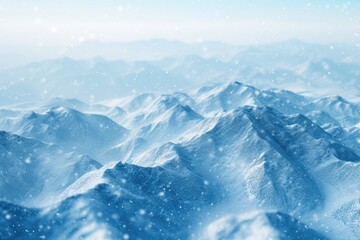 Aerial View from Airplane of Blue Snow Covered Mountain Landscape in Winter. Blurred Background.