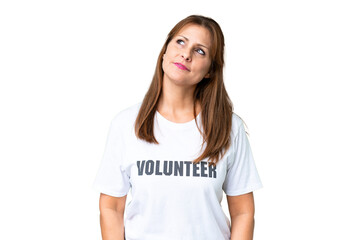 Middle age volunteer woman over isolated background thinking an idea while looking up