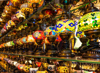 Naklejka premium A row of traditional Arabic multicolored lanterns at the old market.