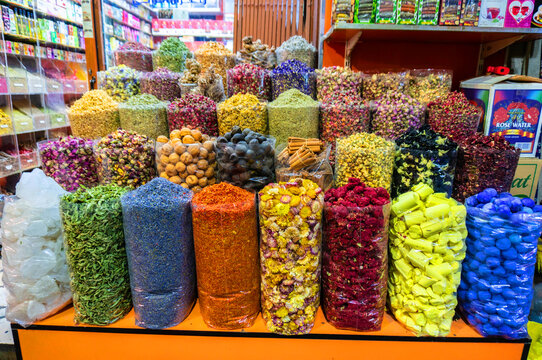 A counter with seasonings and spices in the ancient Arab spice market. A large number of colors and flavors.