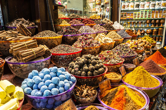 A counter with seasonings and spices in the ancient Arab spice market. A large number of colors and flavors.