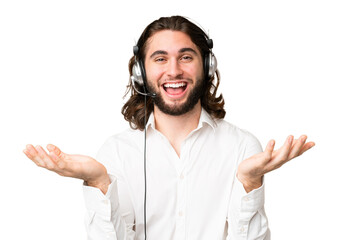 Telemarketer man working with a headset over isolated chroma key background with shocked facial...