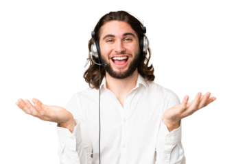 Telemarketer man working with a headset over isolated chroma key background with shocked facial expression