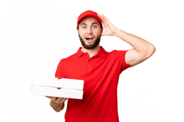 pizza delivery man with work uniform picking up pizza boxes over isolated chroma key background with surprise expression