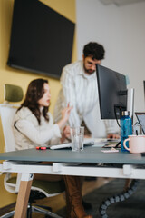 Business coworkers collaborating and brainstorming ideas in a creative office.