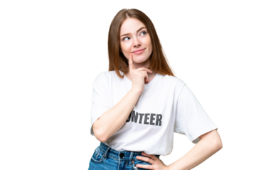 Young volunteer woman over isolated chroma key background thinking an idea while looking up