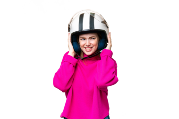 Young pretty woman with a motorcycle helmet over isolated chroma key background frustrated and covering ears