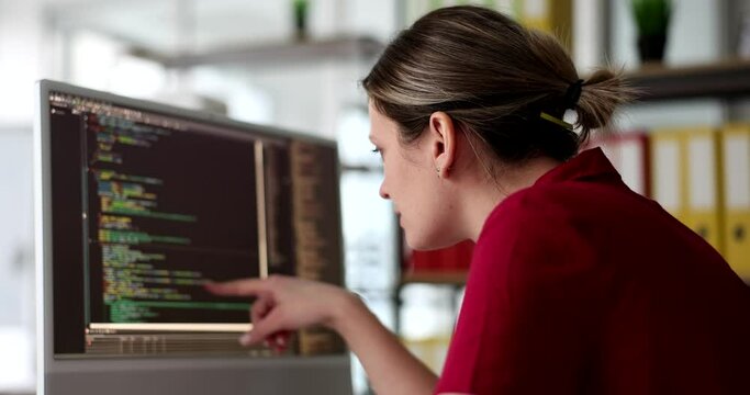 Development of programming and coding technologies woman programmer at computer. Website design programmer working in office of software development company