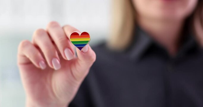 Female hands with heart shape icon symbol. Symbol of lesbian gay bisexual and transgender people