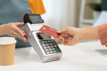 Pay, cashless technology concept, hand of customer using credit card for terminal payment, paying...