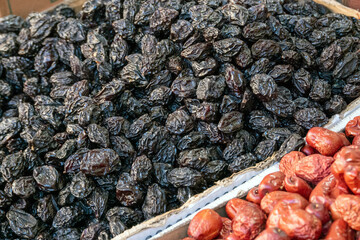 dry black grapes sold openly in the market,