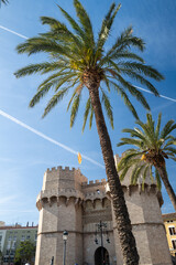 Valencia, Spain - May 12 2023 :  Torre Serranos Towers, a city wall and fortress in bright blue...