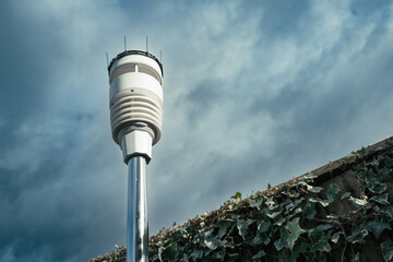 Advanced weather and climate sensor barrage showing ultrasonic wind sensors together temperature,...