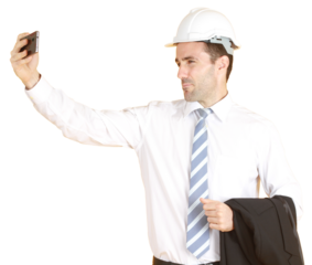 Handsome smart engineer or architecture is Wearing a white safety hat with hand holding smartphone and enjoy with Selfie by himself