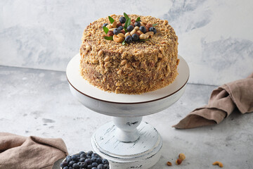 Cake with meringue sponge cake with hazelnuts and butter cream.