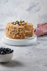 Cake with meringue sponge cake with hazelnuts and butter cream.