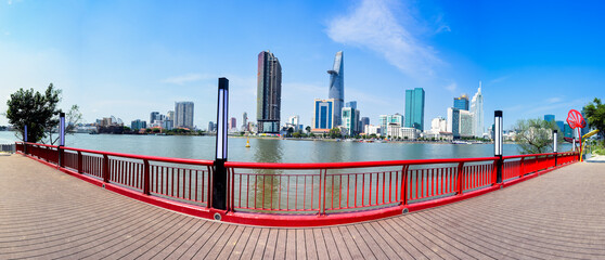 Panorama of Ho Chi Minh City, Vietnam with tall buildings seen from the bridge on the other side of...