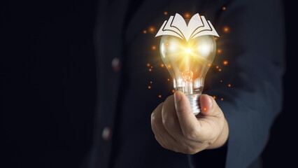 light bulb glowing on book, idea of ​​inspiration from reading, innovation idea concept, Self learning or education knowledge and business studying concept. - obrazy, fototapety, plakaty