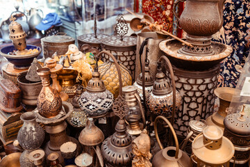 Obraz na płótnie Canvas Variety of metal souvenirs in the flea market of Dubai