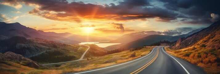 A curvy road winds through the mountains in sunset