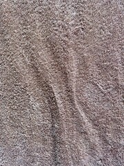 Brown towel texture, fabric background.