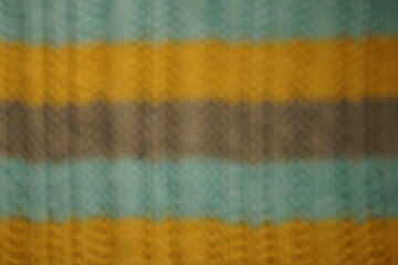 Fototapeta premium Unfocused blurred background with striped blue, gray, yellow threads.