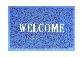 welcome message on blue curly rubber fiber door mat isolated on transparent