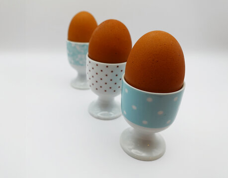 Ceramic Eggcups, Polka Dots, Three Chicken Eggs, White Background