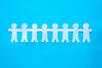 people chain paper on blue