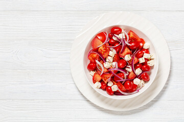 tomato salad with red onion and white cheese