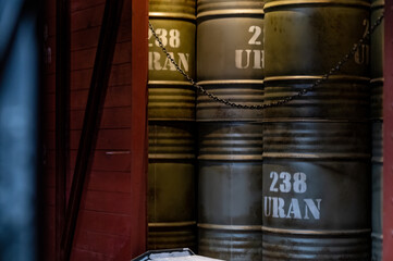 Vintage Barrels with Nuclear energy applications and weapons-grade chemical uranium-238 or U-238 in freight train car © welcomeinside