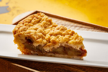Arab Apple Pie Slice served in dish isolated on wooden table top view of arabic sweet dessert