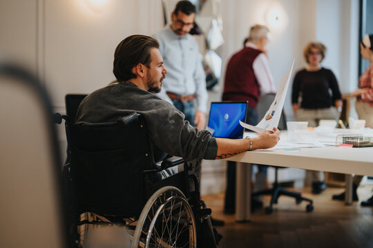 Inclusive workplace environment with diverse team engaging in business projects.