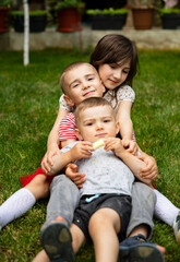 Sister and brothers playing outdoor, Cute children are playing in park, Boys and girl play in yard
