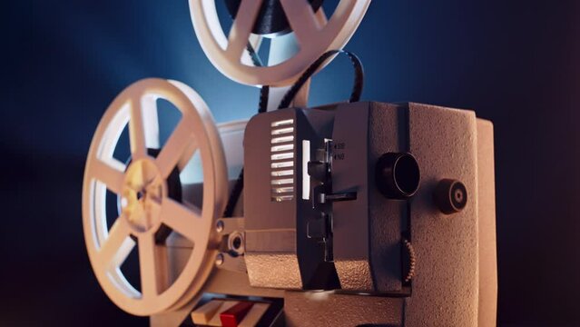 Retro projector playing motion picture. dark room. Timeless flicker of old films
