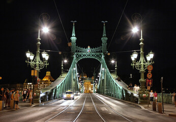 Budapest Hungary green Liberty bridge witha taxi on it   at night