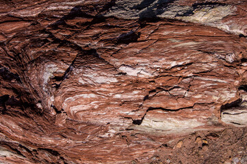 Red stones, blue sky, green water