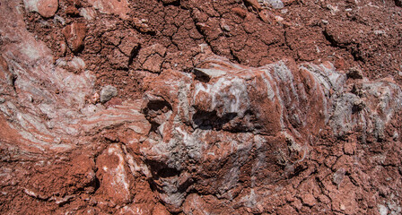 Red stones, blue sky, green water