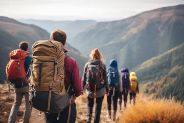 Deurstickers Group of men and women hikers with backpacks  © CStock