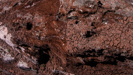 Red stones, blue sky, green water