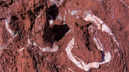 Red stones, blue sky, green water