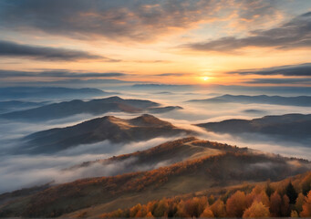 Mountains in fog at beautiful sunset in autumn Landscape mountain valley, low clouds, trees on hills, purple sky with clouds at dusk. Aerial view.