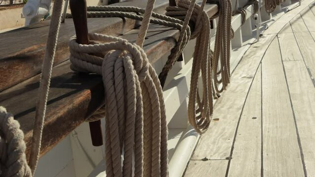 ropes on the deck of a ship, close-up of a rope winding up a winch. close-up in real time