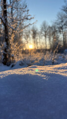 Obraz premium winter in the village, sunset in the snow