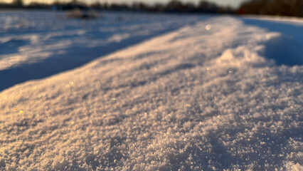 winter in the village, sunset in the snow