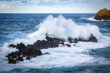 sunset, waves crashing on natural lava swimming pools of porto moniz, madeira, atlantic ocean, portugal, europe, storm, waves, lava