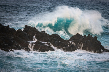 sunset, waves crashing on natural lava swimming pools of porto moniz, madeira, atlantic ocean, portugal, europe, storm, waves, lava