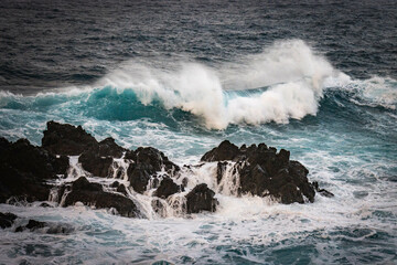 sunset, waves crashing on natural lava swimming pools of porto moniz, madeira, atlantic ocean, portugal, europe, storm, waves, lava