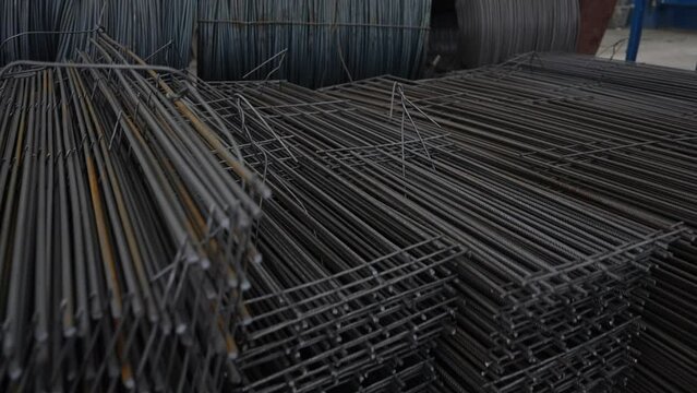 The reinforcing bar. Steel reinforcement bars. Construction rebar steel work reinforcement. Metal fittings for reinforced concrete. Stack of rusty iron rods or bars