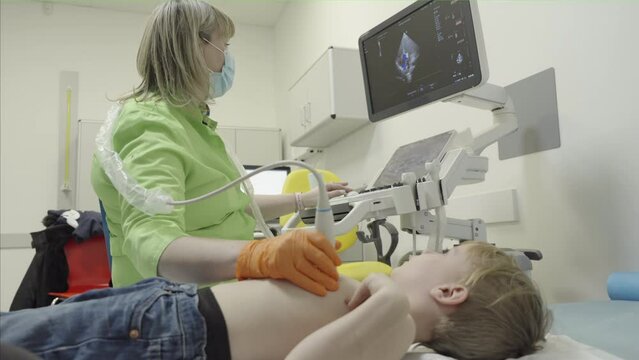 A little boy's heart is checked by ultrasound in a clinic